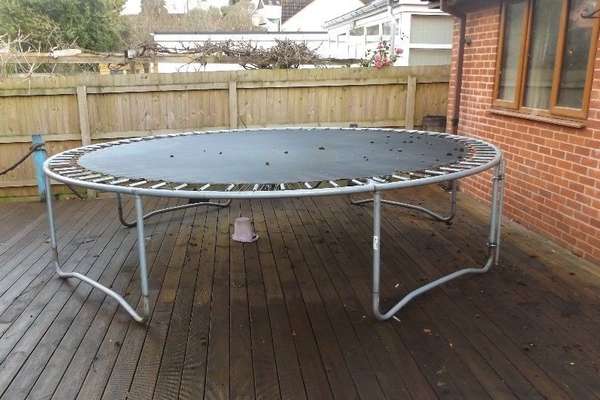 trampoline-on-wooden-deck-backyard-12-ft-opt